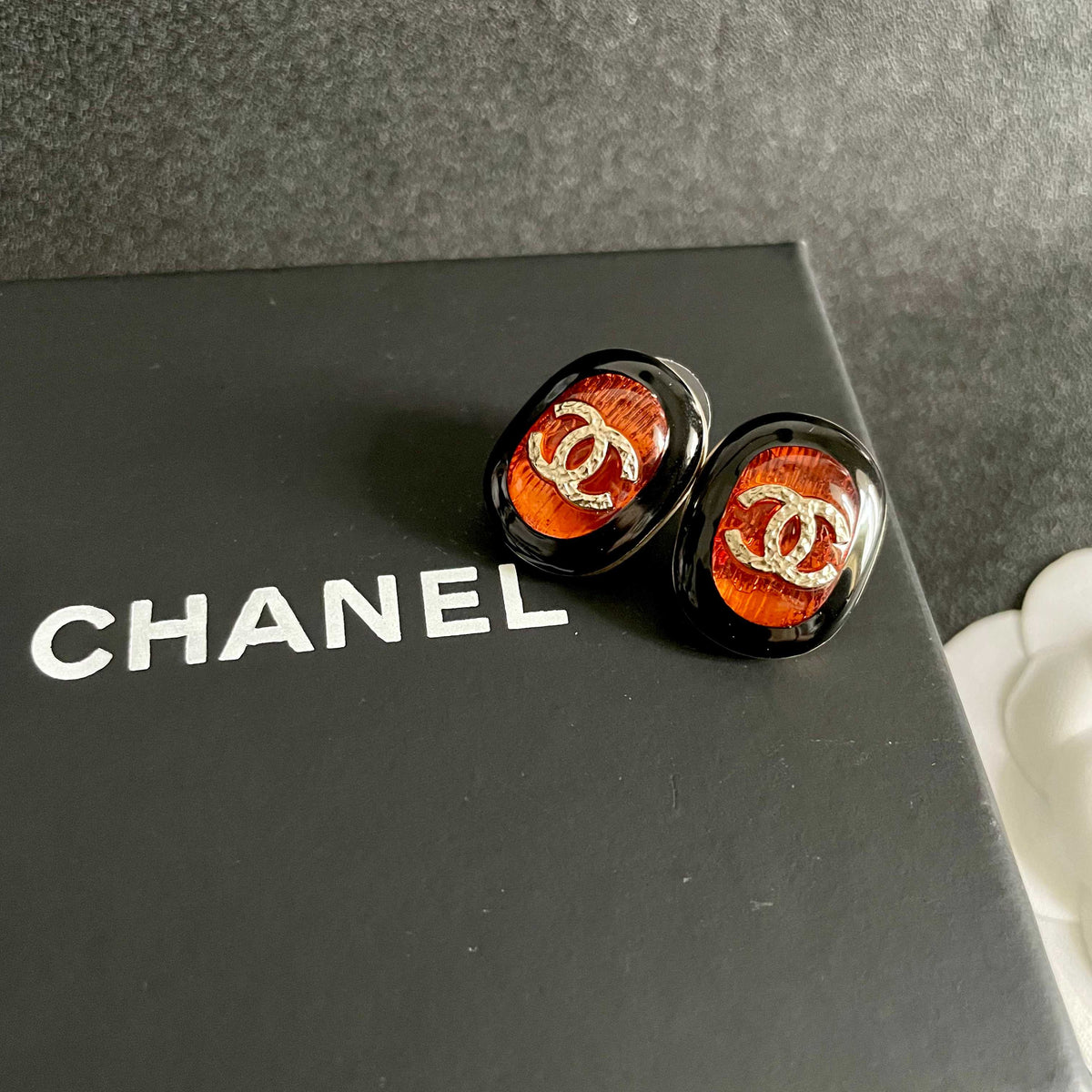 Martin Graham stud earrings in polished metal-tone – detail view