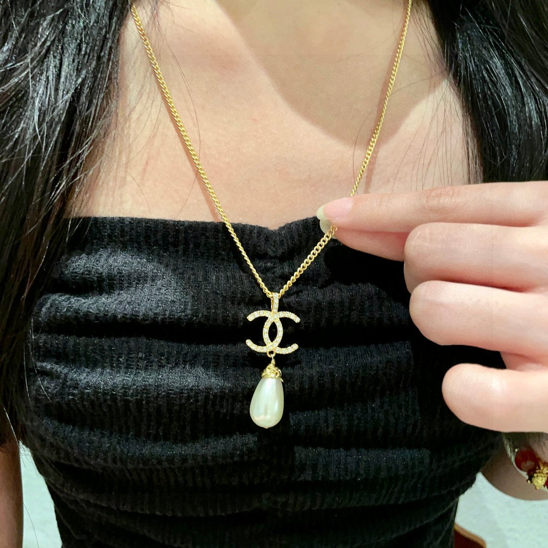 Martin Graham pendant necklace in polished metal-tone – front product view