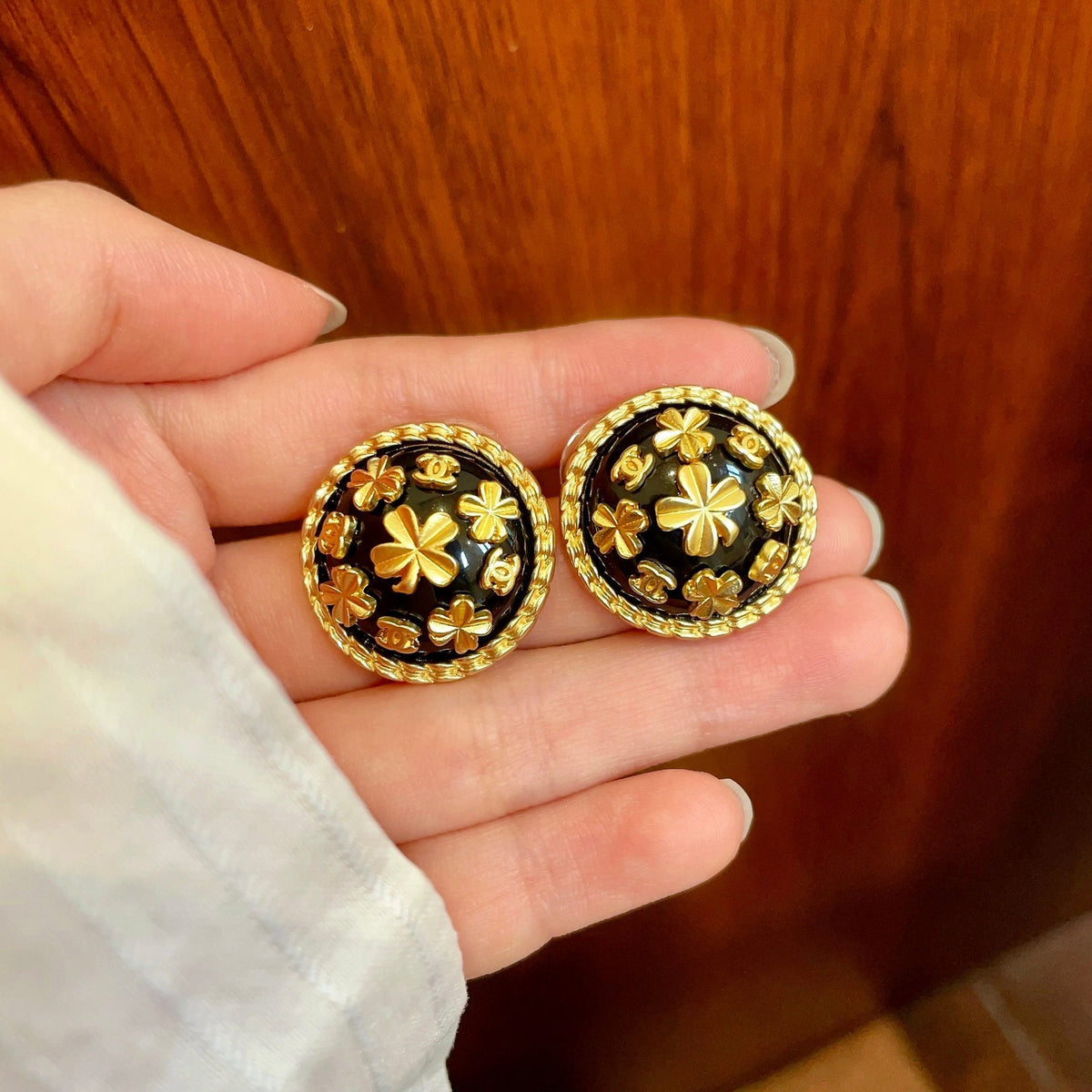 Martin Graham stud earrings in polished metal-tone – side detail
