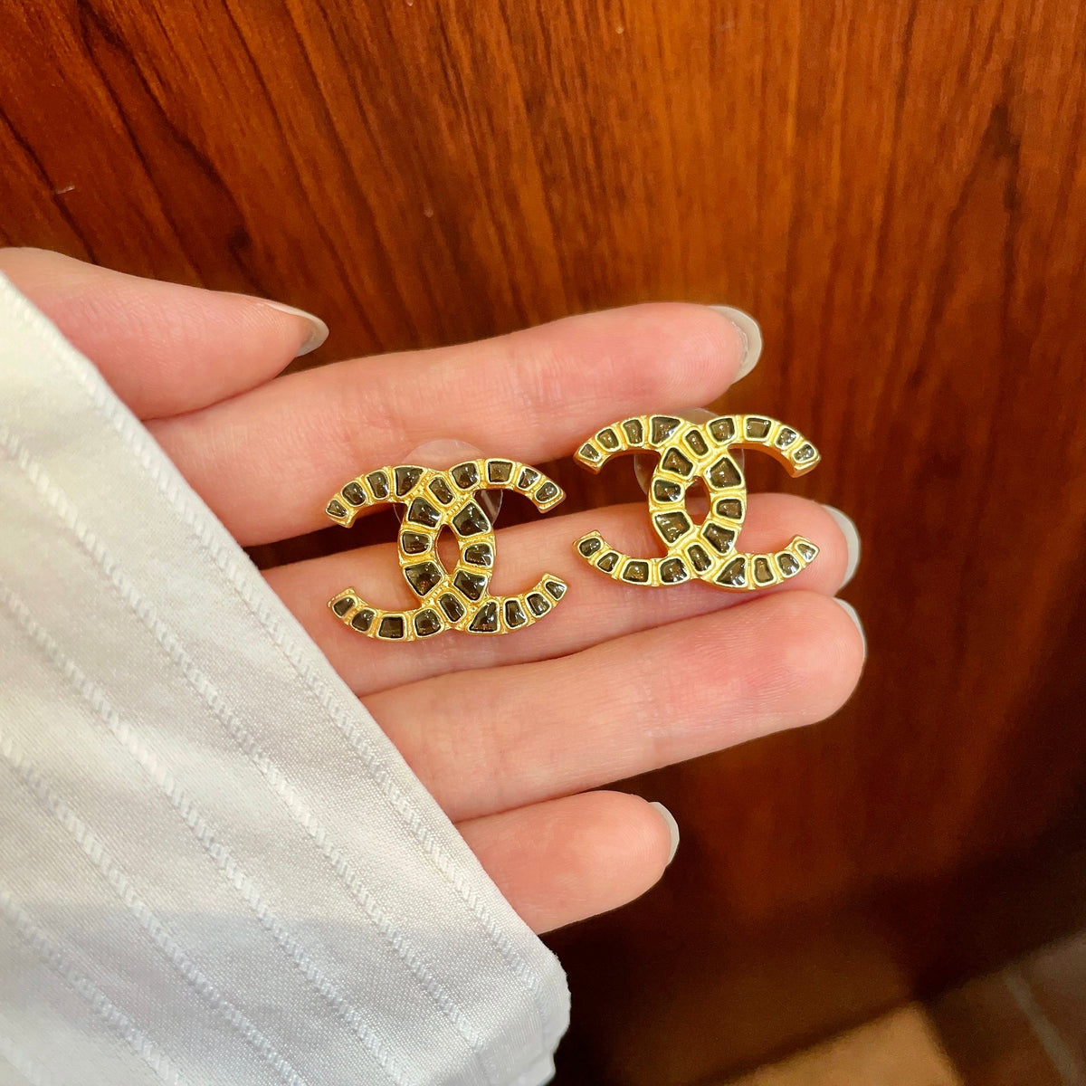 Martin Graham stud earrings in polished metal-tone – side detail