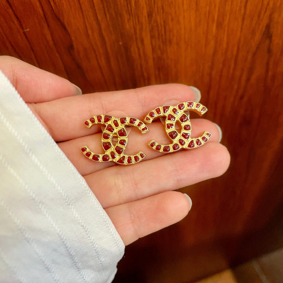 Martin Graham stud earrings in polished metal-tone – side detail