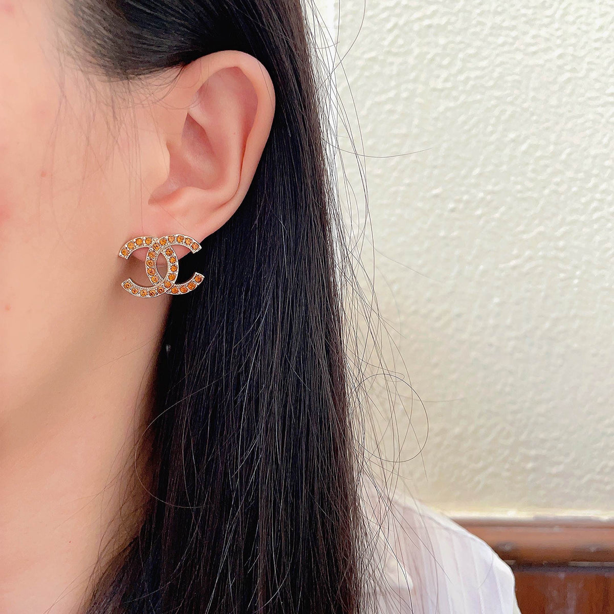 Martin Graham stud earrings in polished metal-tone – detail view