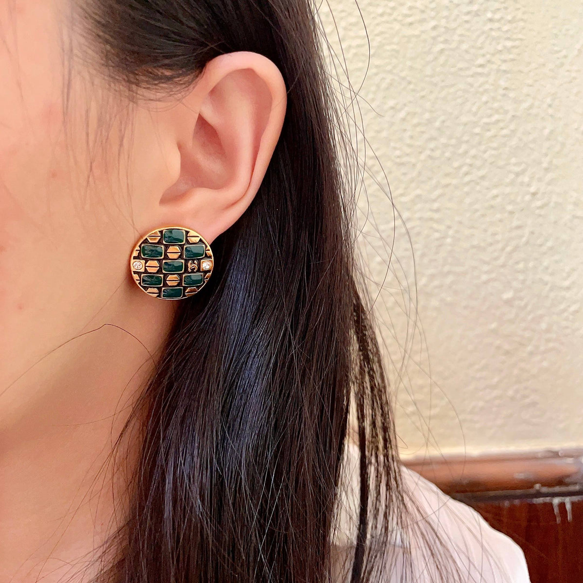 Martin Graham stud earrings in polished metal-tone – detail view
