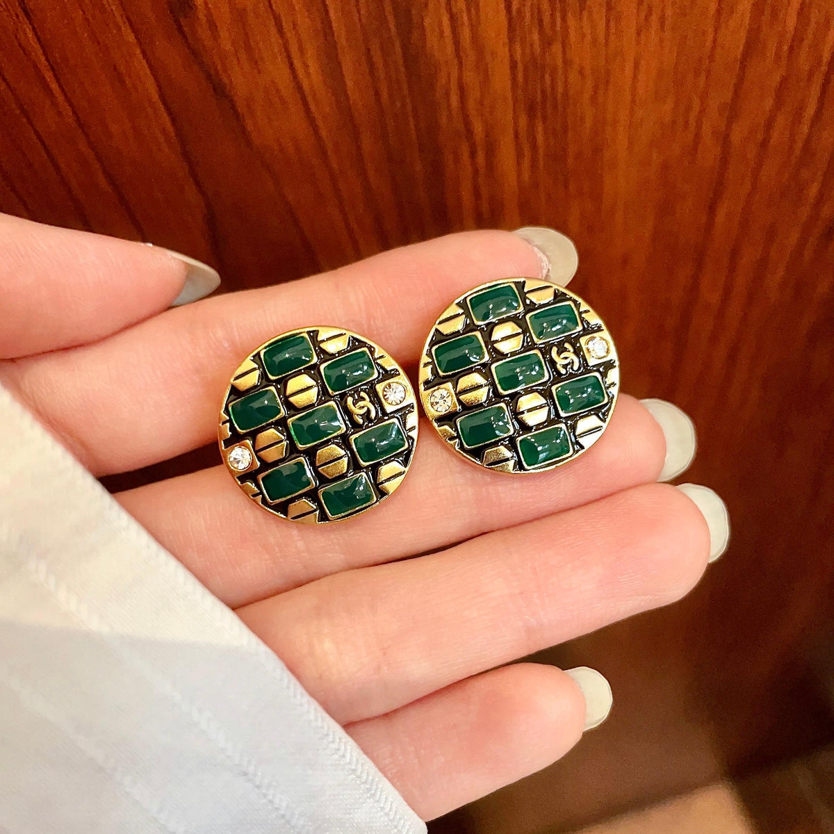Martin Graham stud earrings in polished metal-tone – side detail
