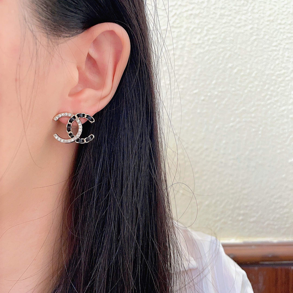Martin Graham stud earrings in polished metal-tone – detail view