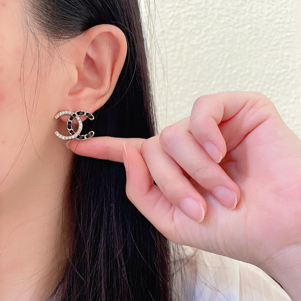 Martin Graham stud earrings in polished metal-tone – front product view