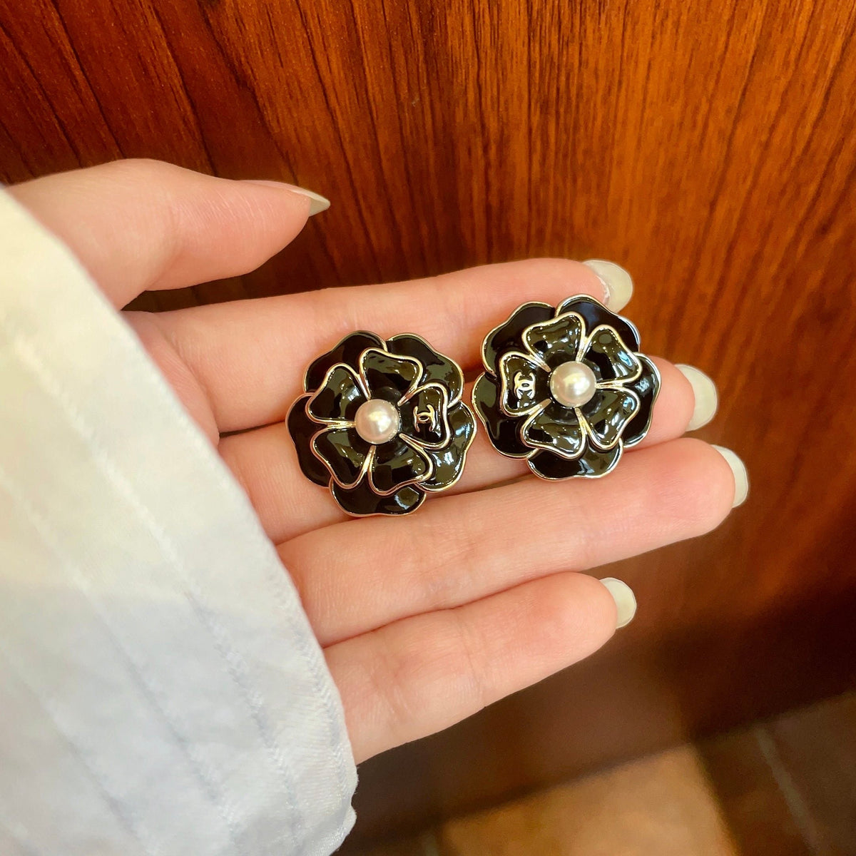 Martin Graham stud earrings in polished metal-tone – side detail