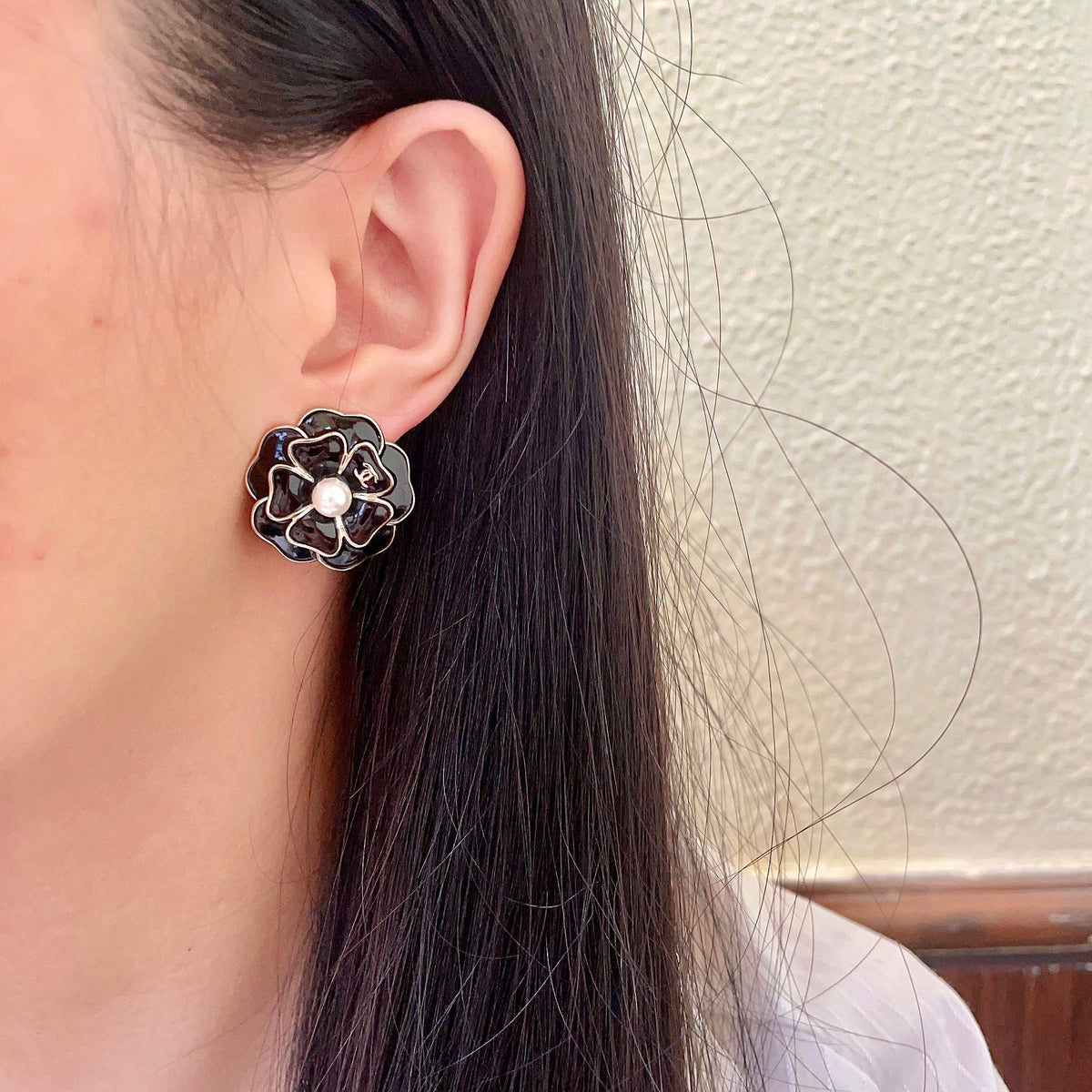 Martin Graham stud earrings in polished metal-tone – detail view