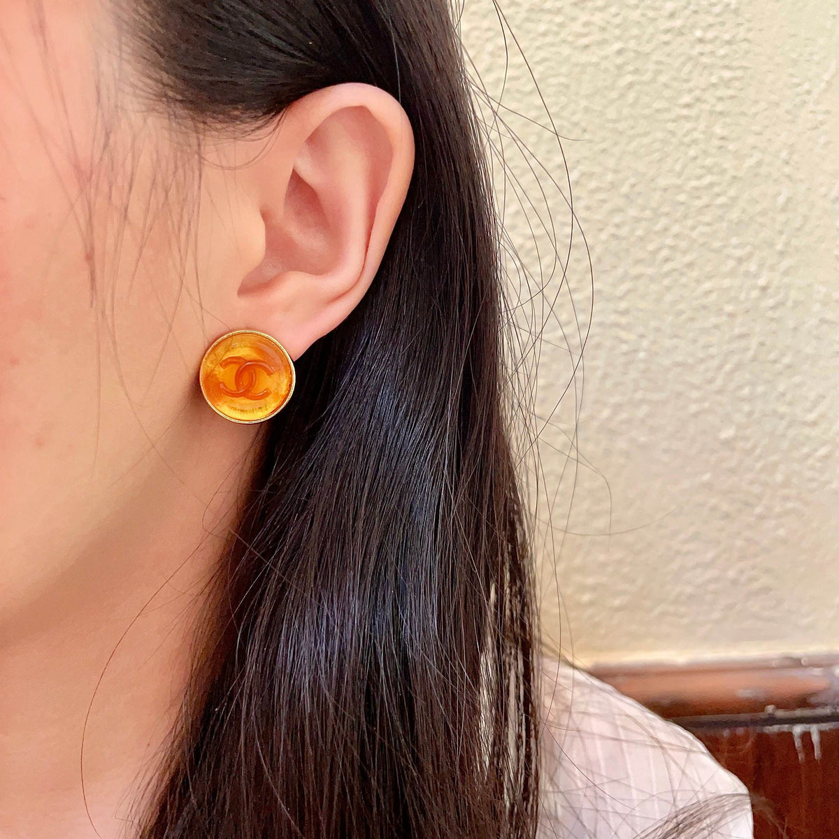 Martin Graham stud earrings in polished metal-tone – detail view