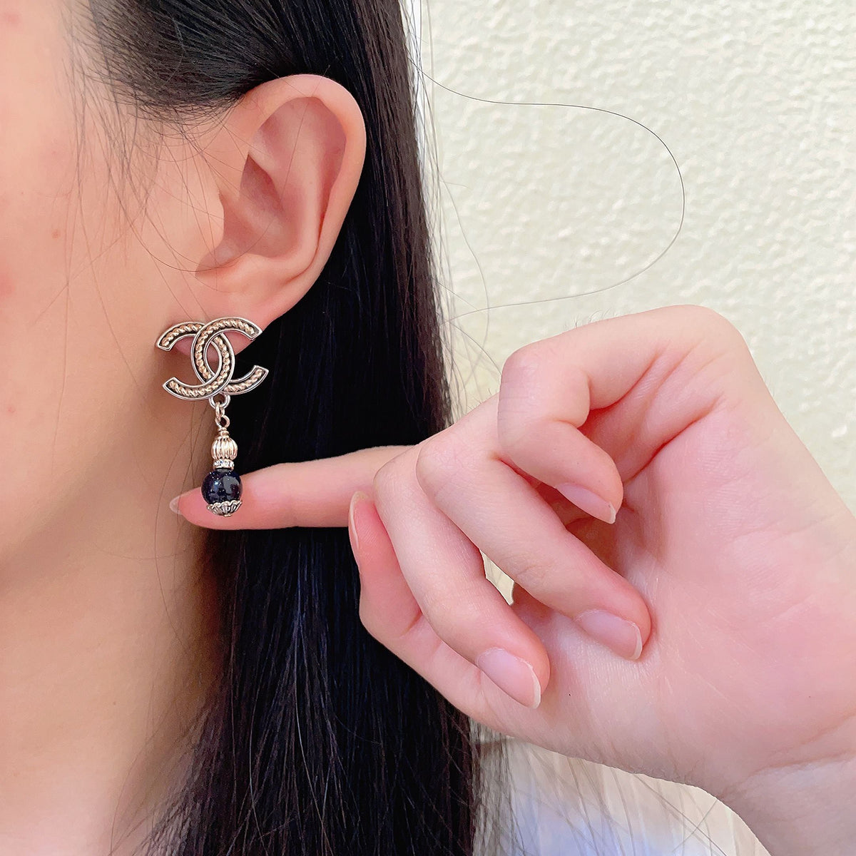 Martin Graham earrings in polished metal-tone – front product view