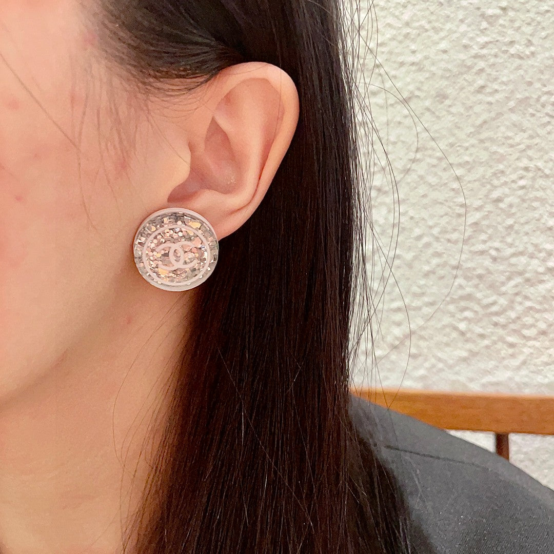 Martin Graham stud earrings in polished metal-tone – detail view