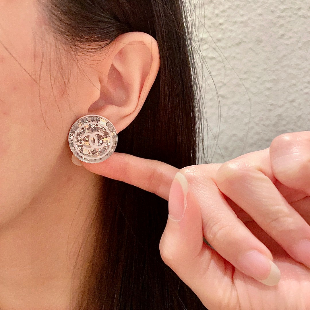 Martin Graham stud earrings in polished metal-tone – front product view