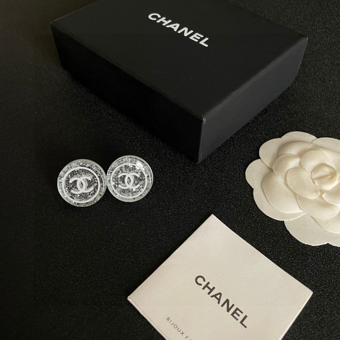 Martin Graham stud earrings in polished metal-tone – close-up detail