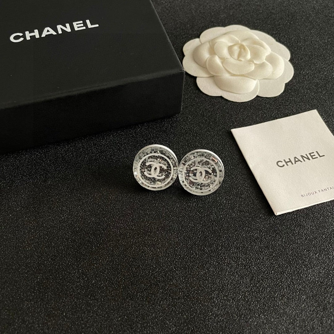 Martin Graham stud earrings in polished metal-tone – styled product view