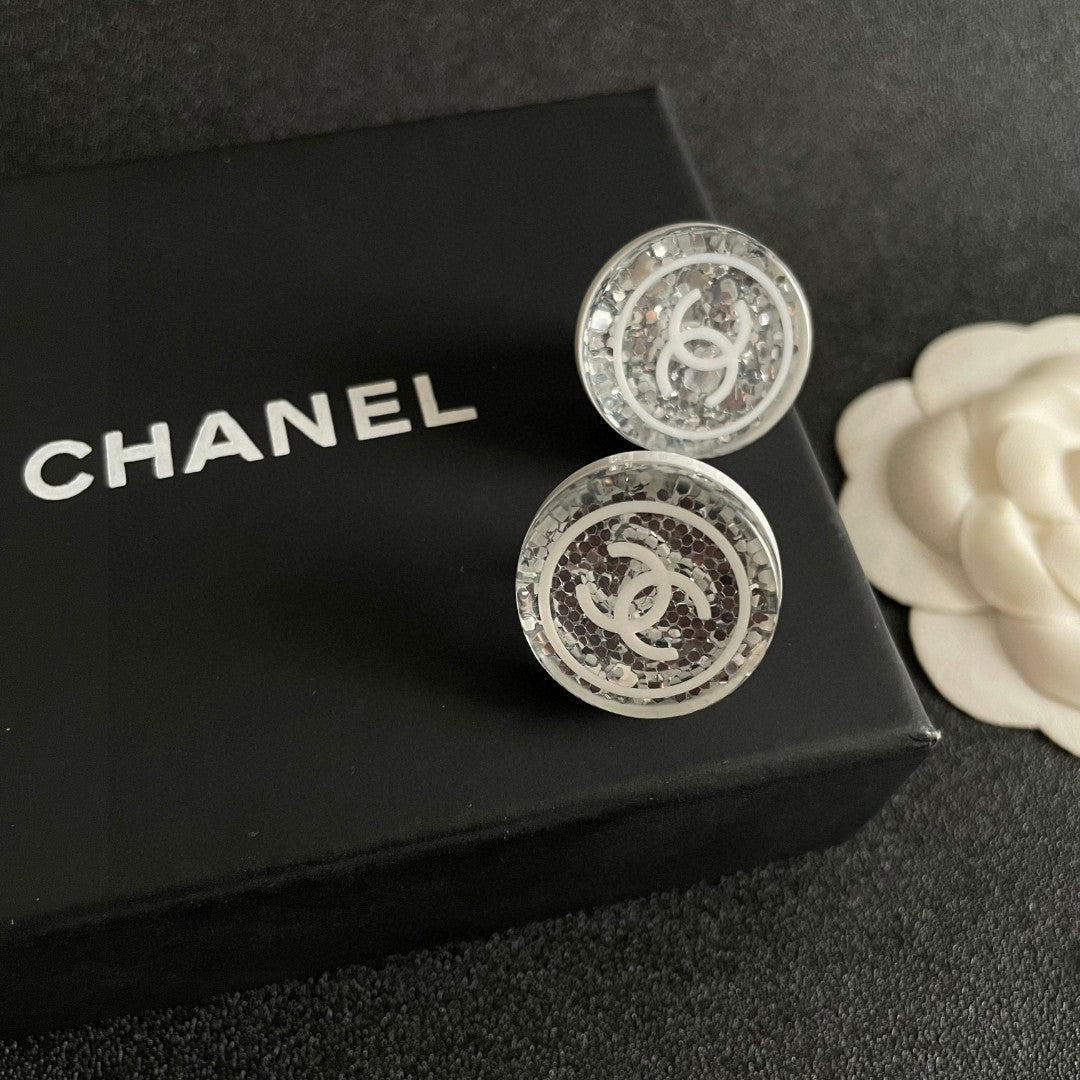 Martin Graham stud earrings in polished metal-tone – detail view