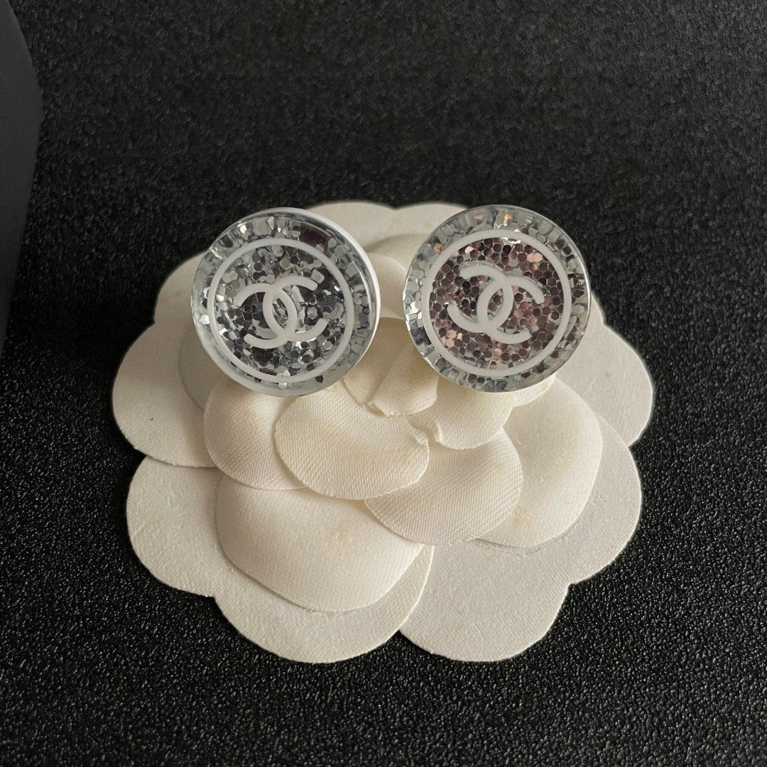 Martin Graham stud earrings in polished metal-tone – front product view