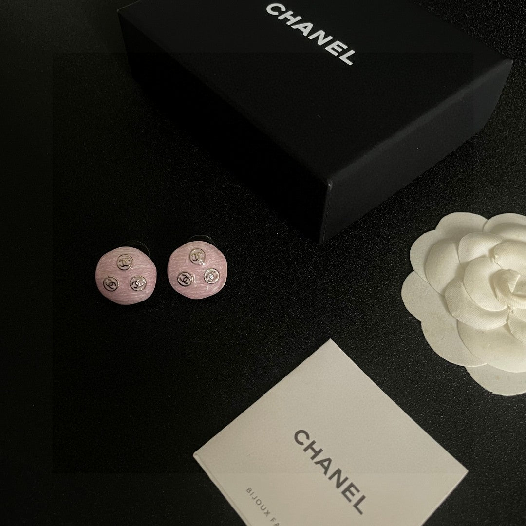 Martin Graham stud earrings in polished metal-tone – close-up detail