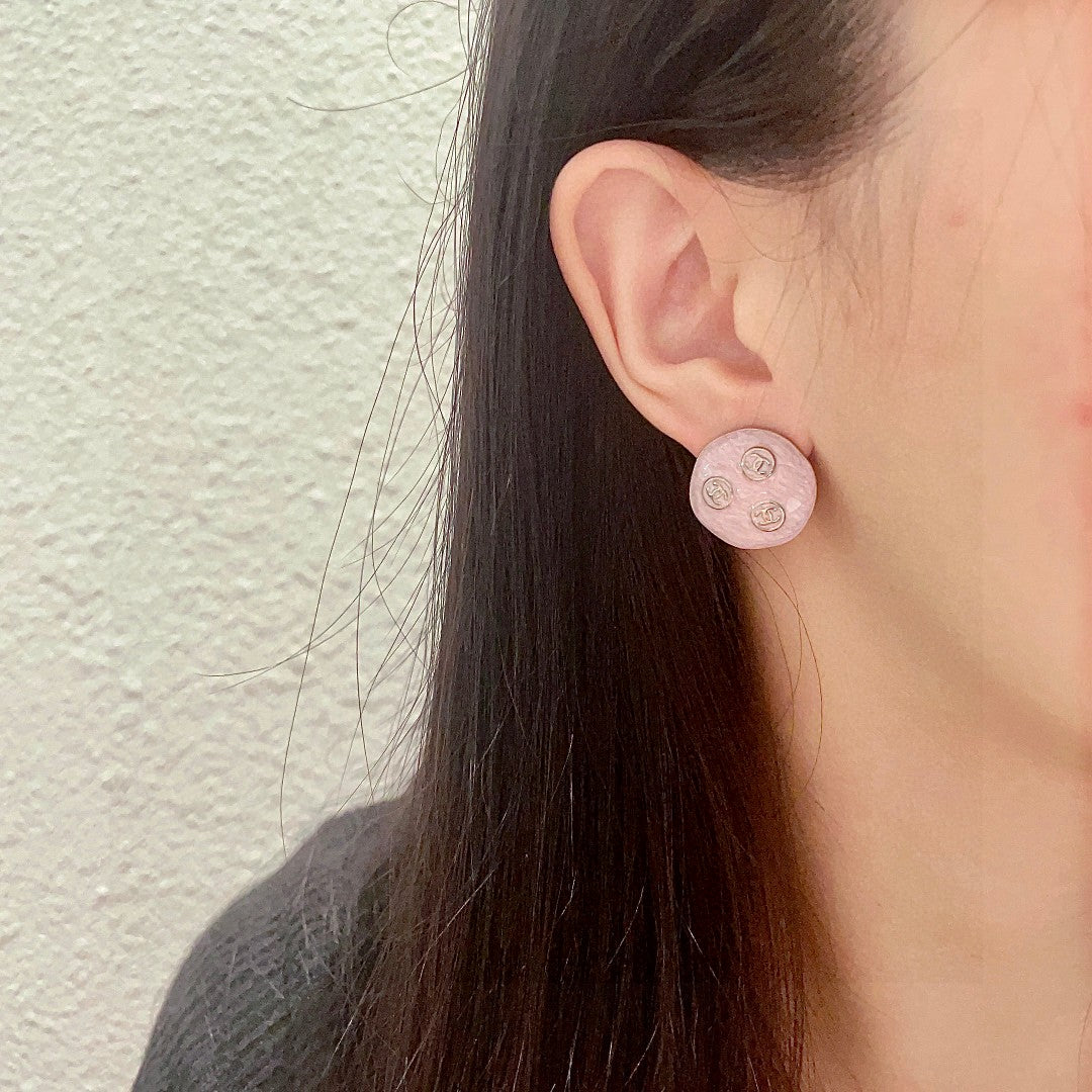 Martin Graham stud earrings in polished metal-tone – detail view