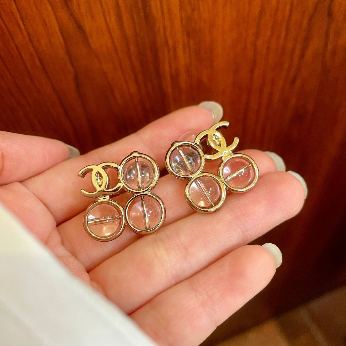 Martin Graham stud earrings in polished metal-tone – side detail