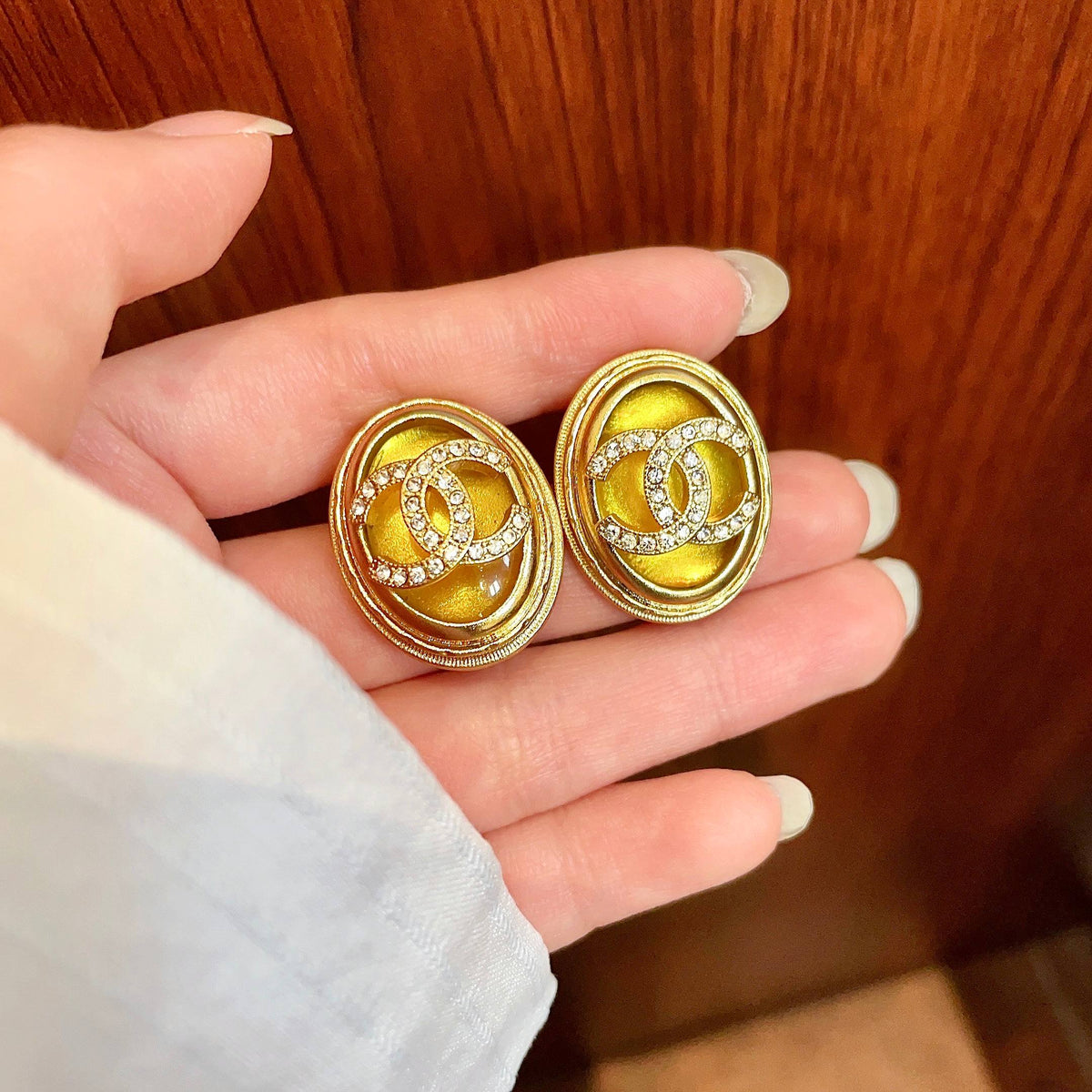 Martin Graham stud earrings in polished metal-tone – side detail