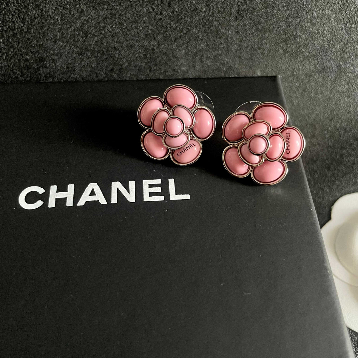 Martin Graham stud earrings in polished metal-tone – detail view