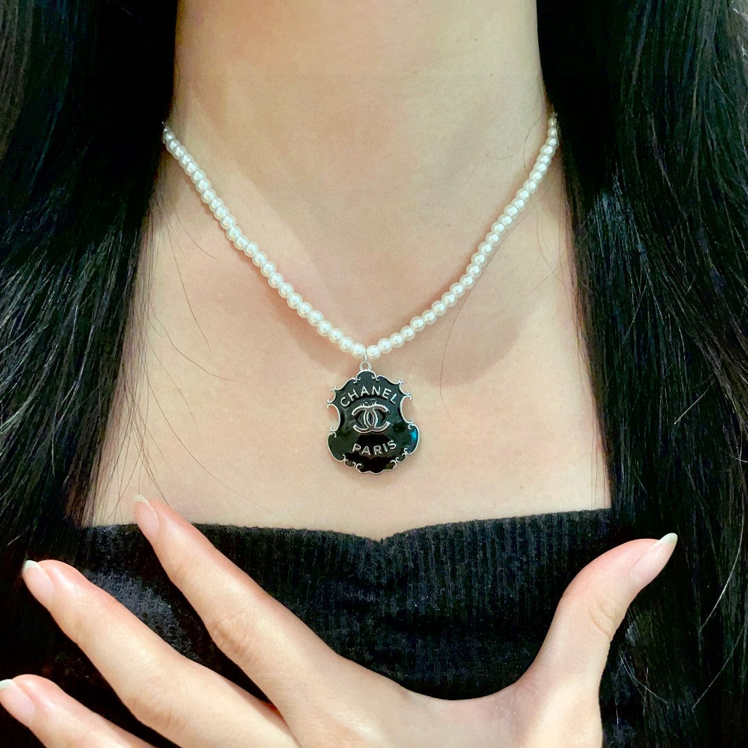 Martin Graham pendant necklace in polished metal-tone – front product view