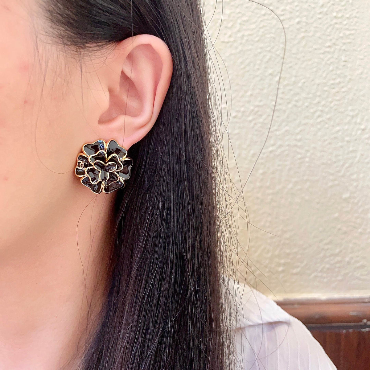 Martin Graham stud earrings in polished metal-tone – detail view