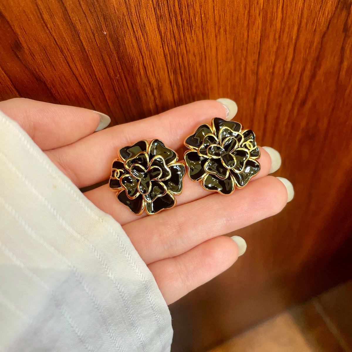 Martin Graham stud earrings in polished metal-tone – side detail