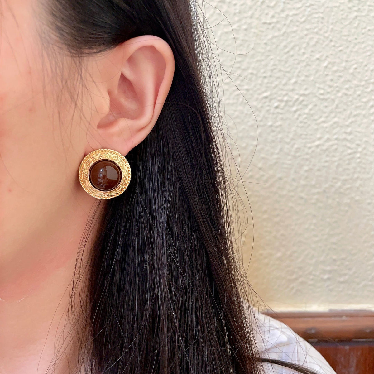 Martin Graham stud earrings in polished metal-tone – detail view