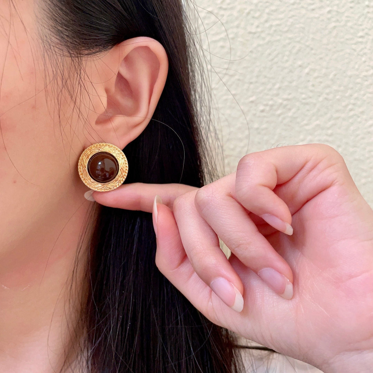 Martin Graham stud earrings in polished metal-tone – front product view