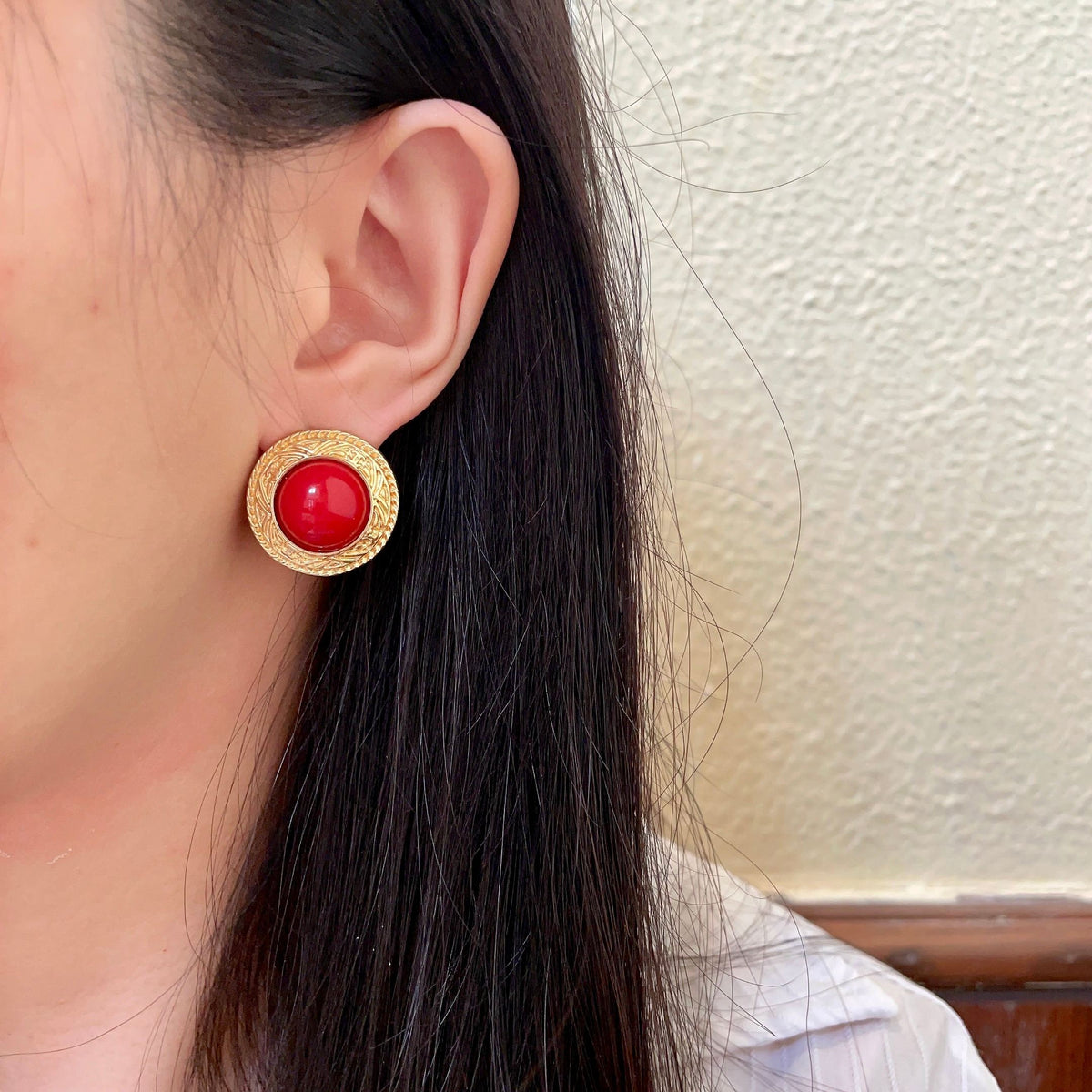 Martin Graham stud earrings in polished metal-tone – detail view