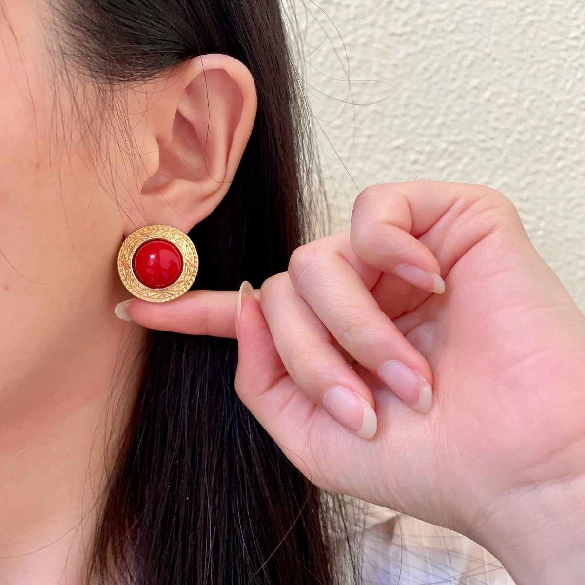 Martin Graham stud earrings in polished metal-tone – front product view