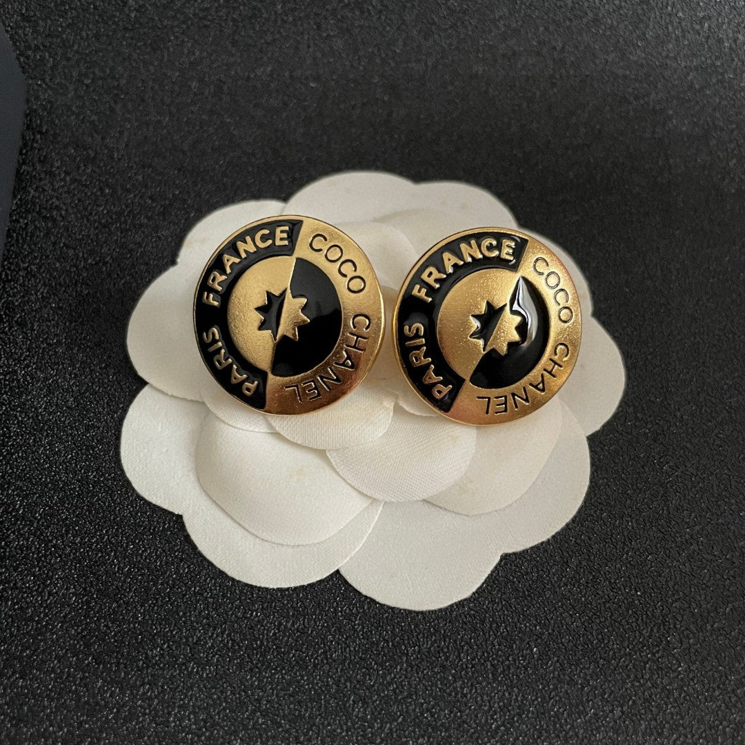 Martin Graham stud earrings in polished metal-tone – front product view