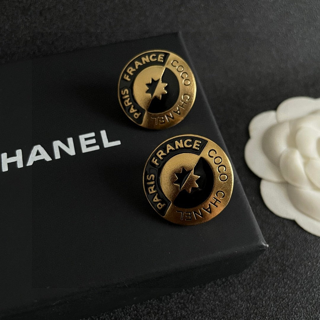 Martin Graham stud earrings in polished metal-tone – detail view