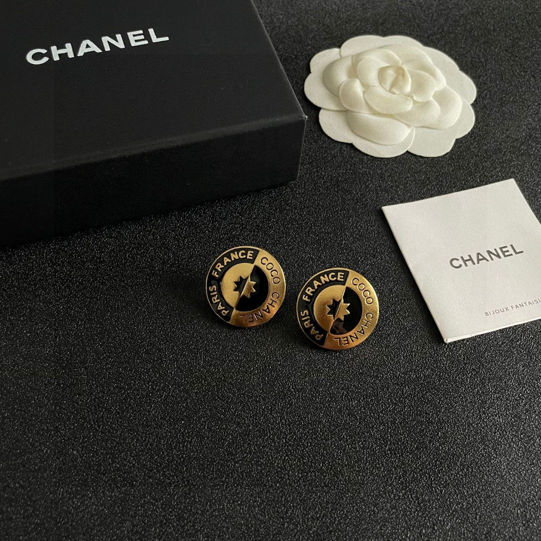 Martin Graham stud earrings in polished metal-tone – styled product view