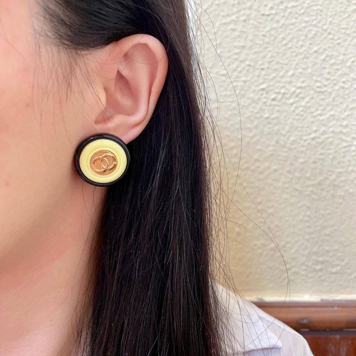 Martin Graham stud earrings in polished metal-tone – detail view