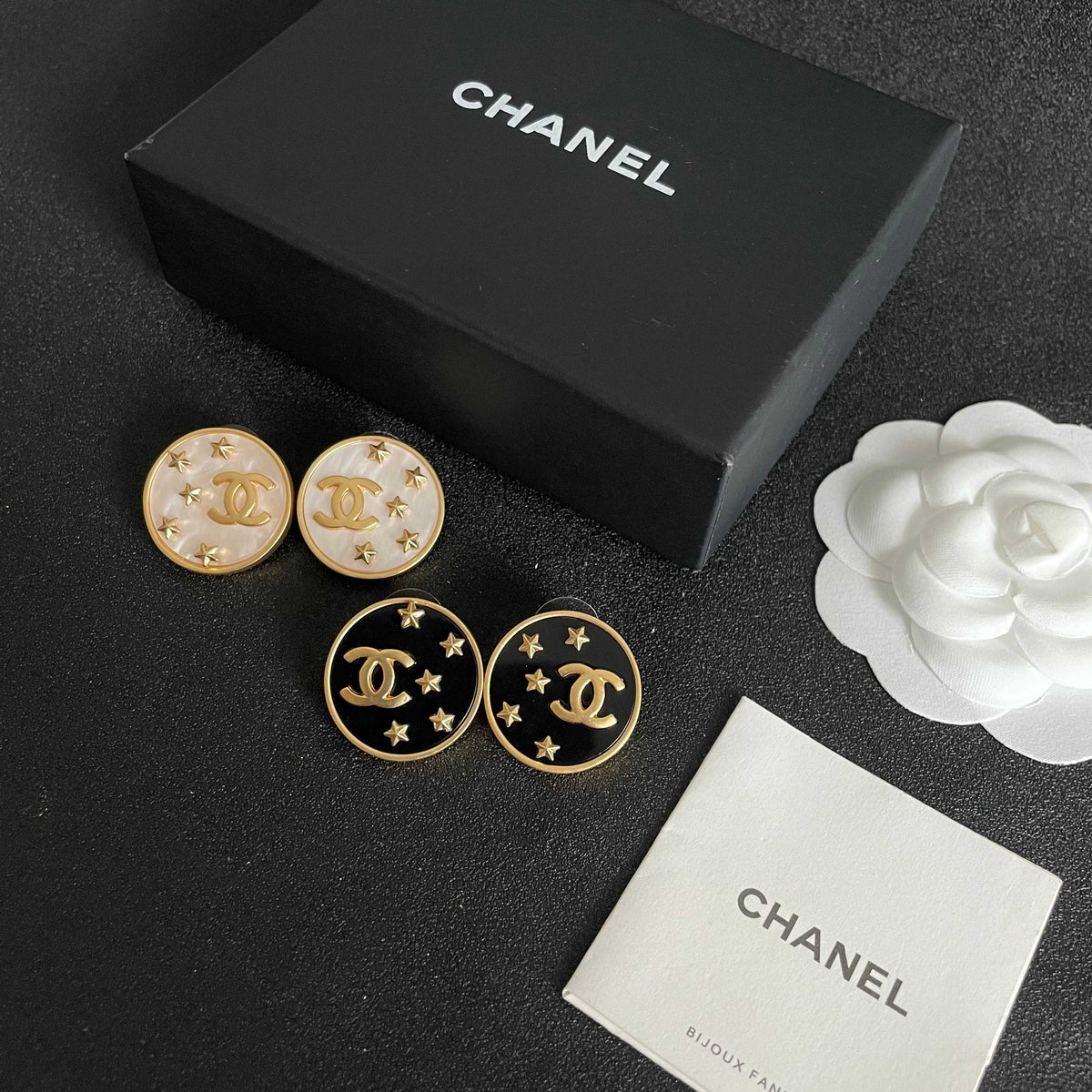 Martin Graham stud earrings in polished metal-tone – close-up detail