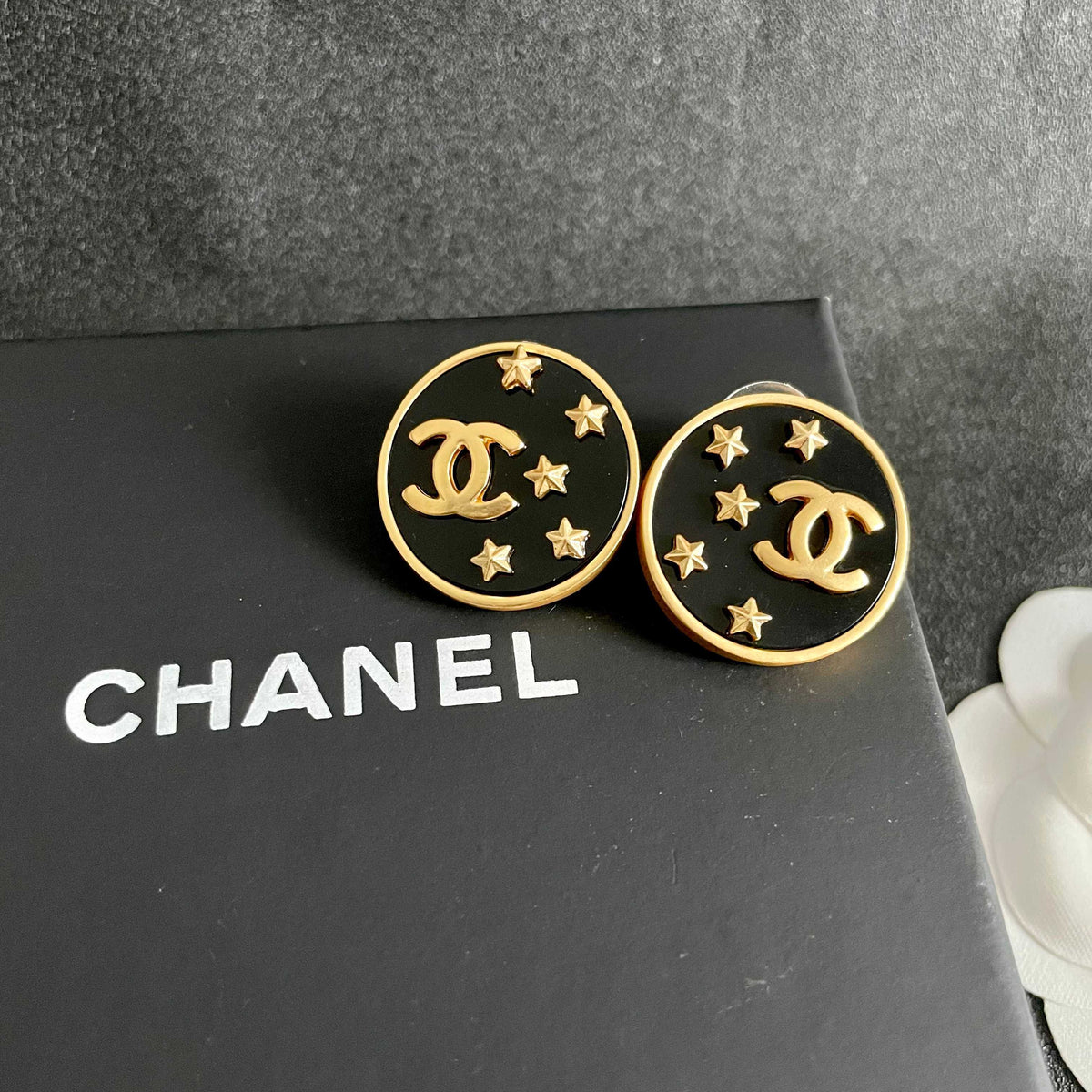 Martin Graham stud earrings in polished metal-tone – detail view