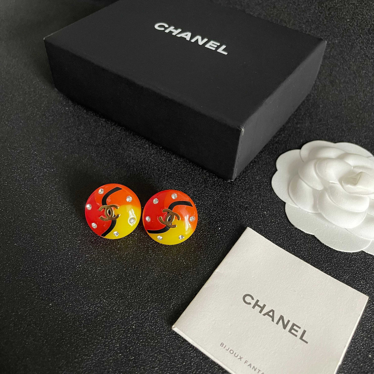 Martin Graham stud earrings in polished metal-tone – close-up detail