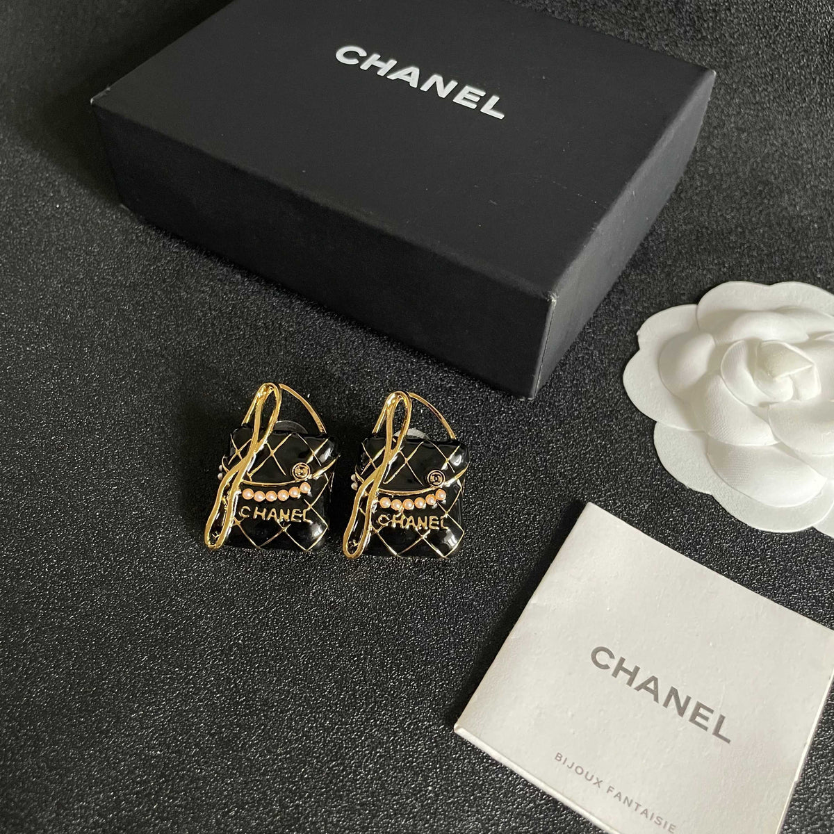 Martin Graham stud earrings in polished metal-tone – close-up detail