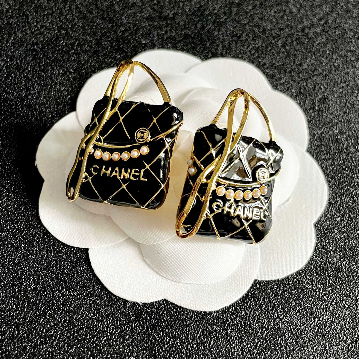 Martin Graham stud earrings in polished metal-tone – front product view