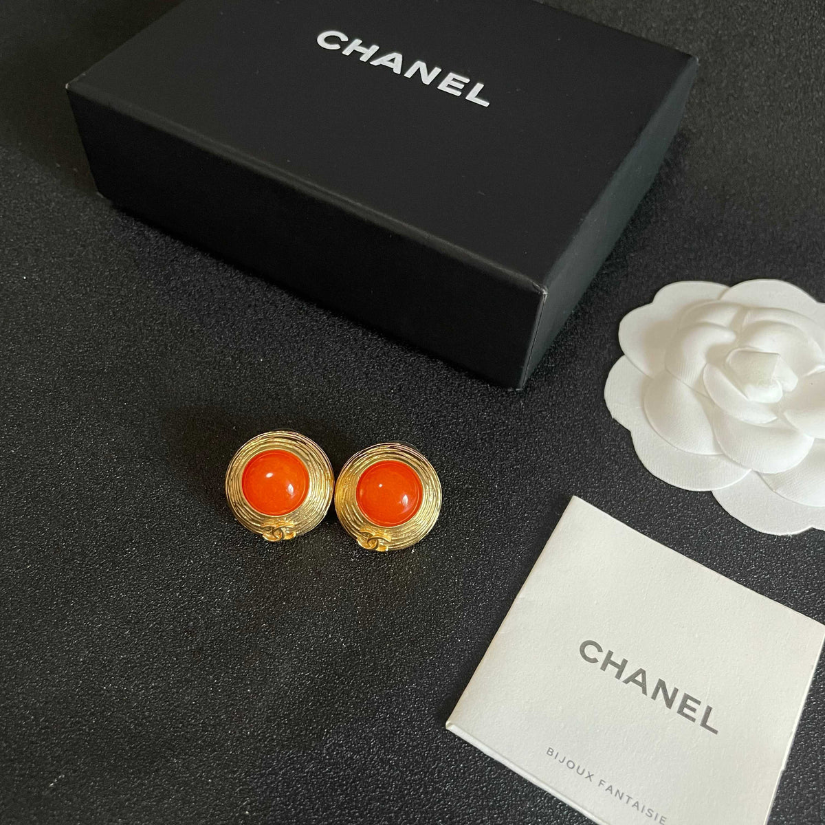 Martin Graham stud earrings in polished metal-tone – close-up detail