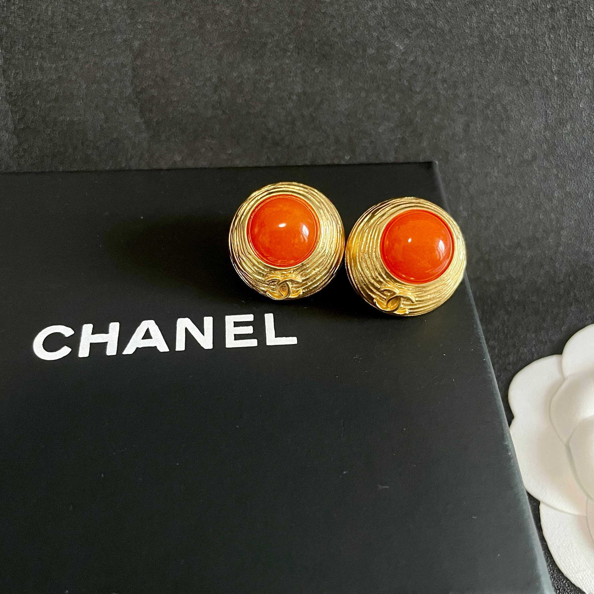 Martin Graham stud earrings in polished metal-tone – detail view