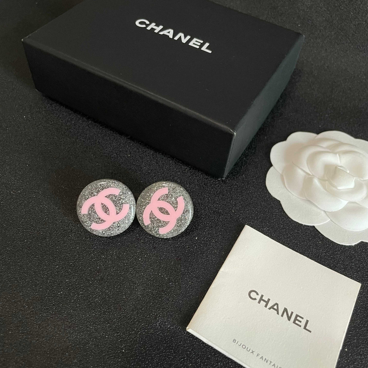 Martin Graham stud earrings in polished metal-tone – close-up detail