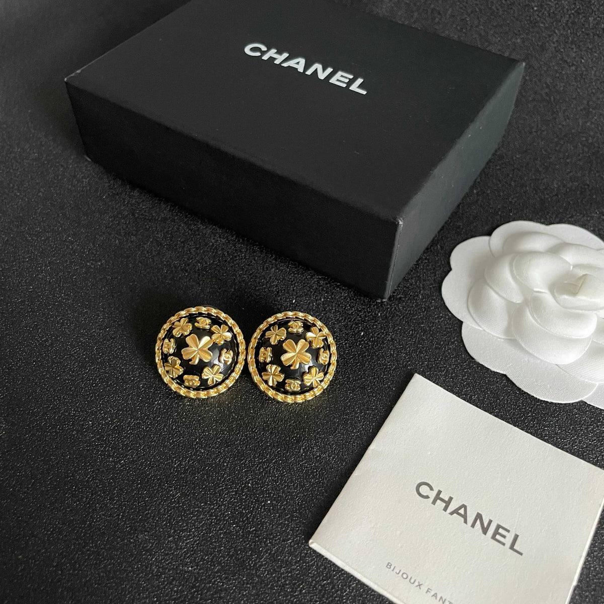 Martin Graham stud earrings in polished metal-tone – close-up detail