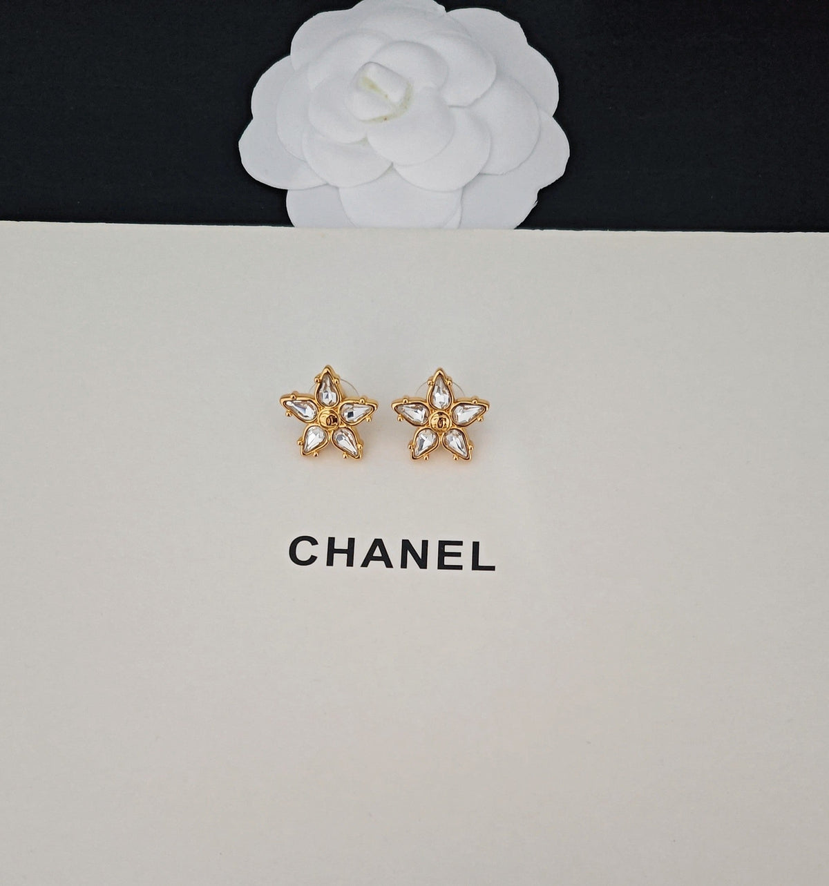 Martin Graham stud earrings in polished metal-tone – side detail
