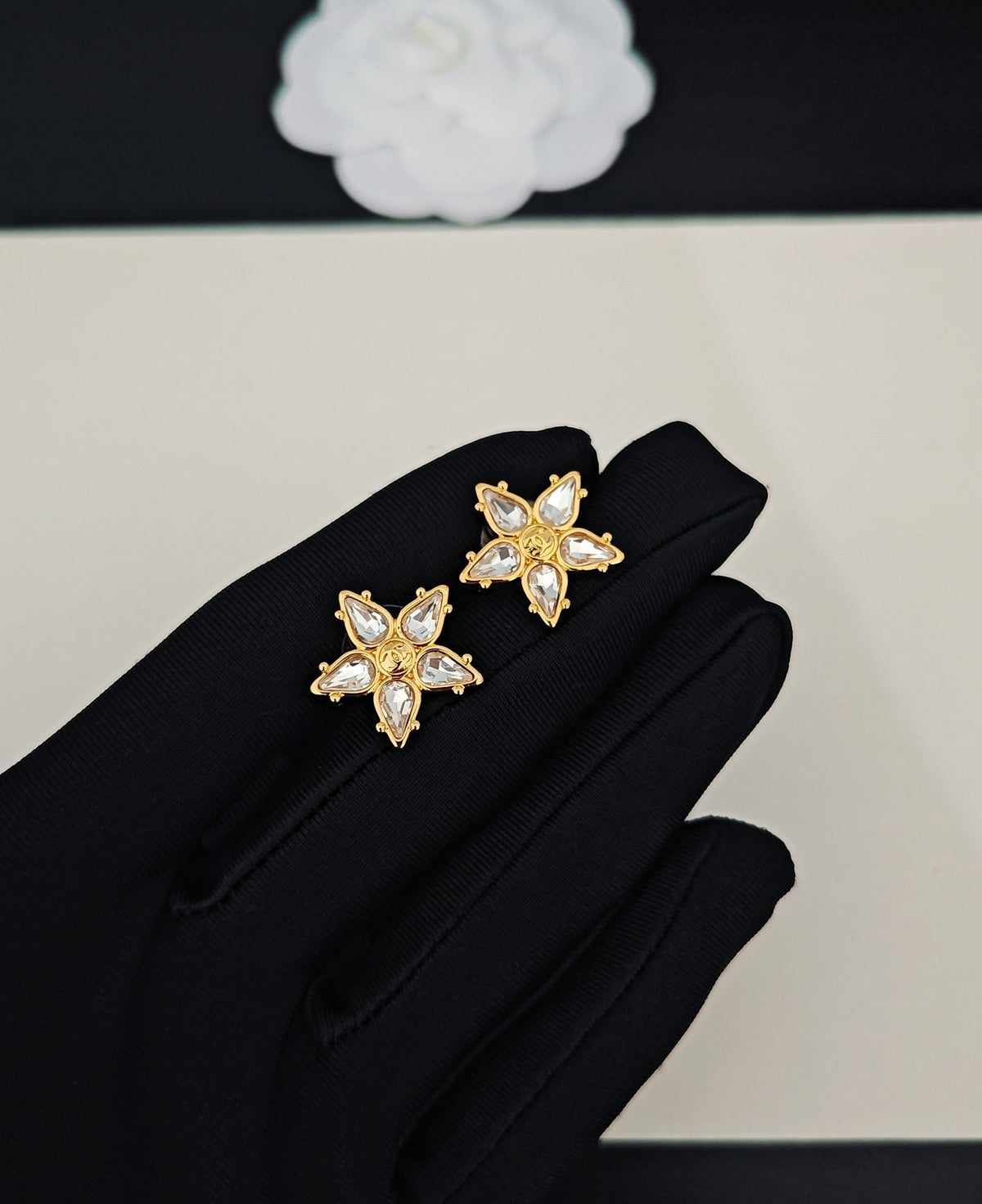 Martin Graham stud earrings in polished metal-tone – detail view