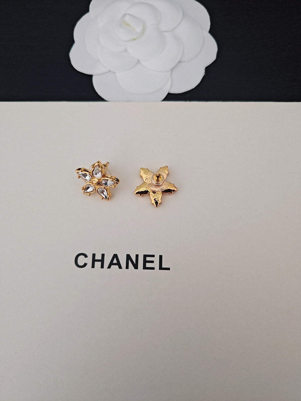 Martin Graham stud earrings in polished metal-tone – styled product view