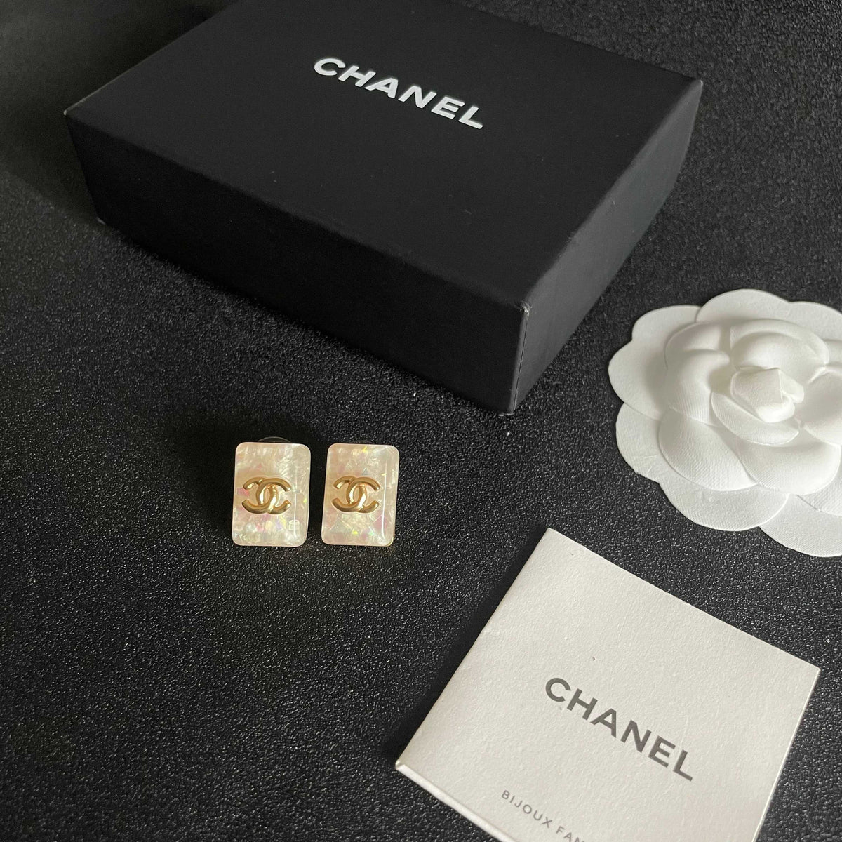 Martin Graham stud earrings in polished metal-tone – close-up detail