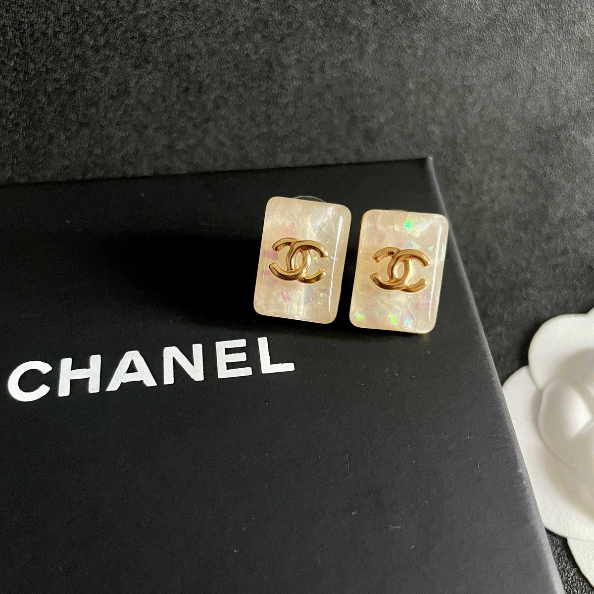 Martin Graham stud earrings in polished metal-tone – detail view